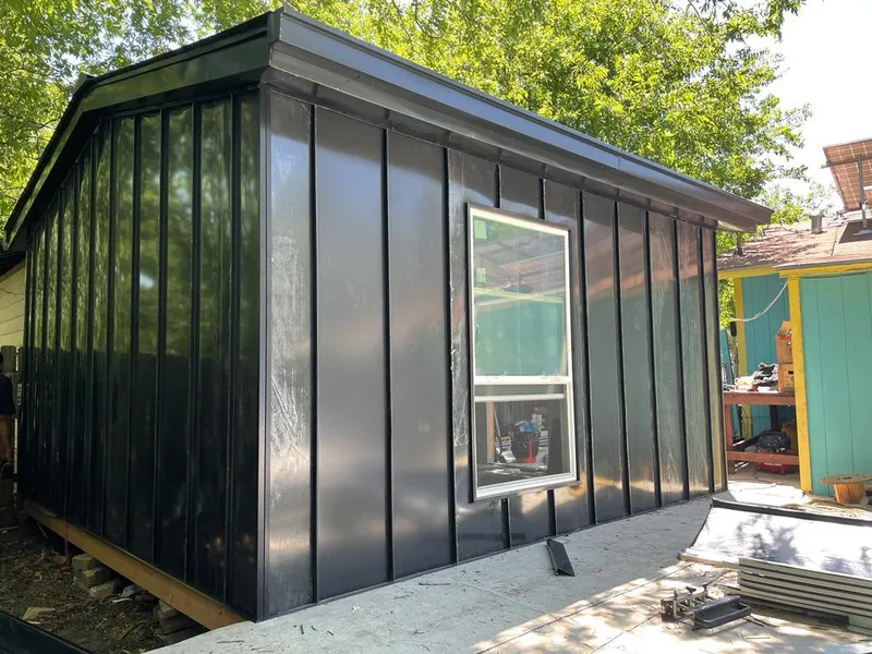 Black standing seam metal wall panels for Roof Inspection in Clarkson