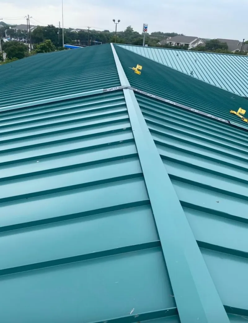 Green commercial metal roof ridge and valley for Metal Roof Repair in Clarkson